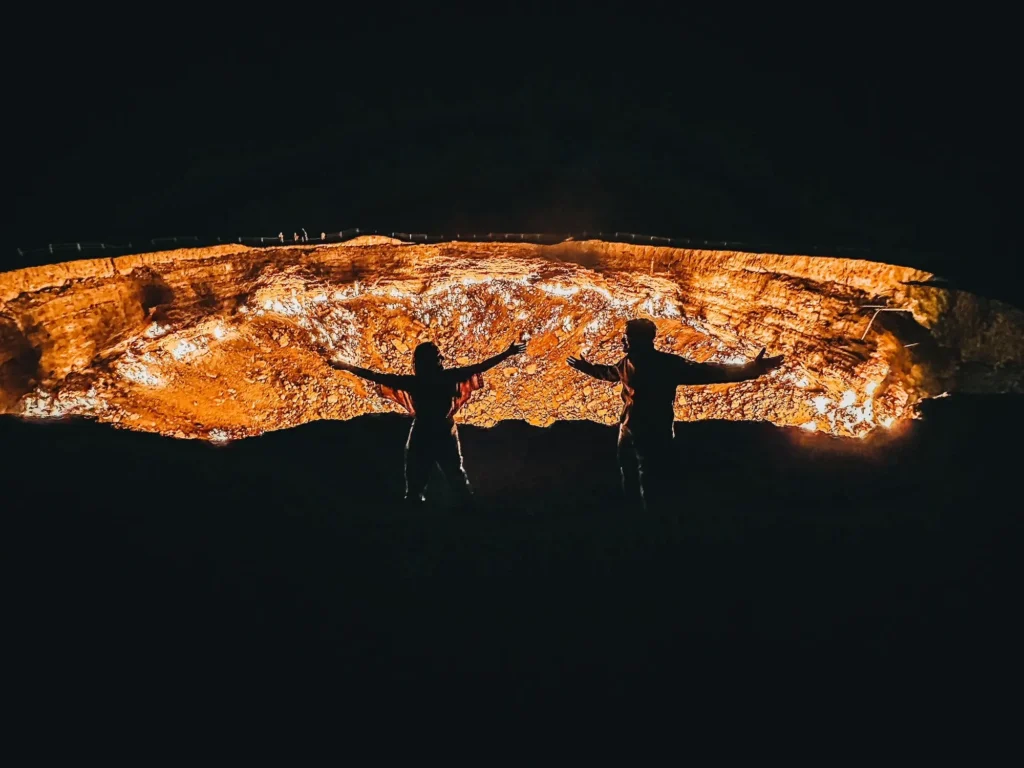 silhouette-people-in-front-of-gas-crater